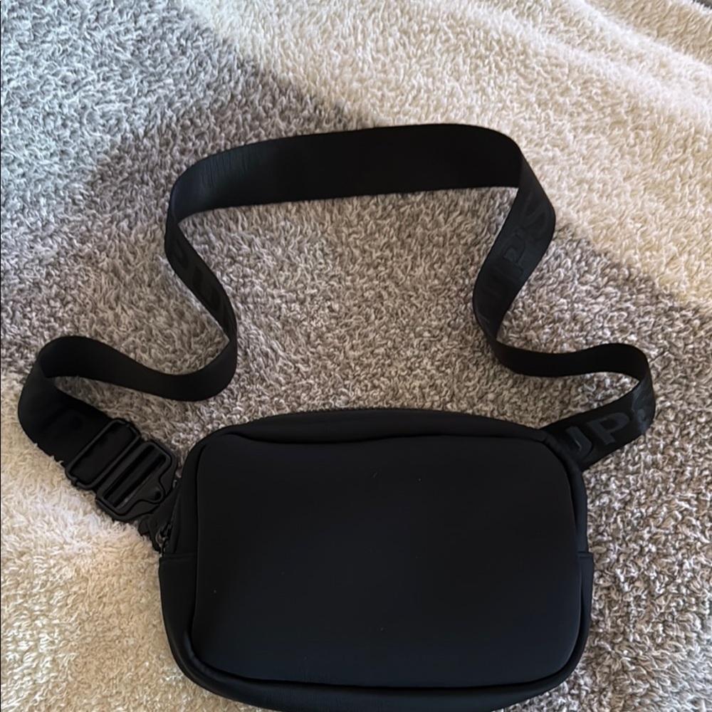 Pop Ups brand cross body pack. Great nylon fabric wipes clean. Like new!